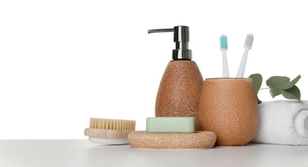 Bath accessories. Different personal care products and eucalyptus branch on table against white background. Space for text