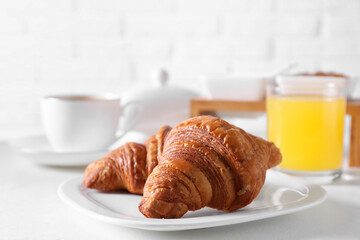 Fresh croissants on white table. Tasty breakfast