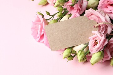 Happy Mother's Day. Beautiful flowers and blank card on pink background, closeup. Space for text