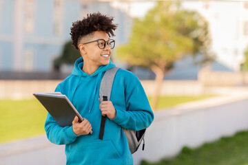 Moving student with backpack looking forward