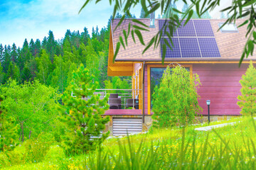 Vacation home. Cottage near forest. Mansion with solar panels on roof. Country house among...