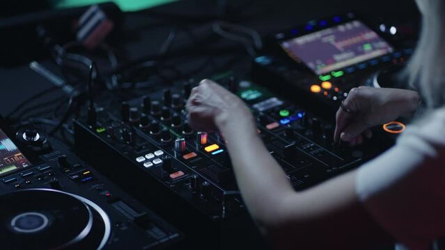 Closeup View Of Modern DJ Controller In Nightclub, Woman DJ Mixing Tracks For Dancers