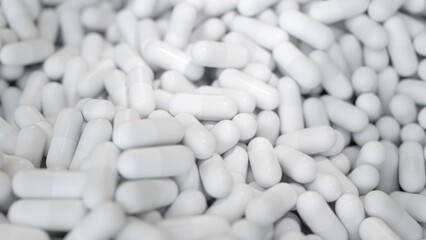 White capsules in an endless 3D animation.
