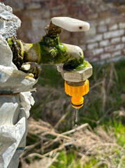 Water tap is dripping close-up