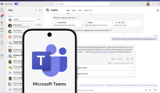 Microsoft Teams logo is displayed on a modern smartphone and application in the background, business, conferencing, meeting, collaboration