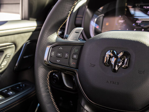 Novosibirsk, Russia - March  22 , 2024:  Dodge Ram Trx, Car controller on steerling wheel ,Music,Control System Function and voice telephone in car. modern car interior