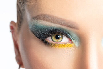 Close up view of beautiful woman eyes with a bright makeup.