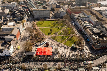 Wide aerial shot of Eire Square in Galway, capturing the Saint Patrick's Day Parade on a sunny day