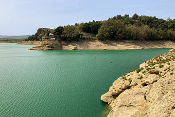 Lake Embalse conde de Guadalhorce on sunny day in El Chorro, Malaga, Spain
