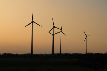 wind turbines at sunset