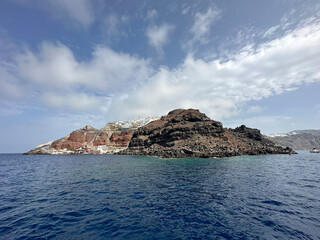 Fototapeta na wymiar Rocky shores of Santorini island
