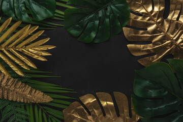 Creative layout with gold and green tropical palm leaves on black background.