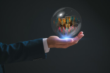 investment and finance concept, businessman holding virtual trading graph and blurred coins in bubble on hand, stock market, profits and business growth