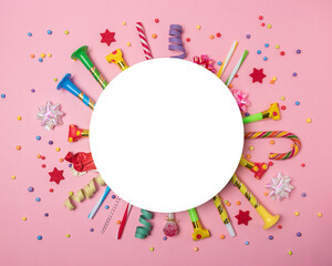 Colorful celebration background with various party confetti, streamers and decoration. Minimal party concept. Flat lay.