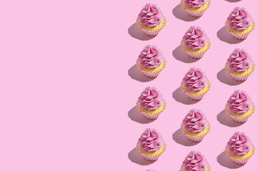 Colorful cupcake pattern on pastel pink background. Creative minimal party concept.