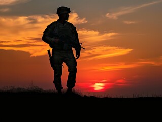 A soldier stands on a hillside at sunset, looking out over the horizon. The sky is filled with clouds, and the sun is setting in the distance. Scene is peaceful and contemplative