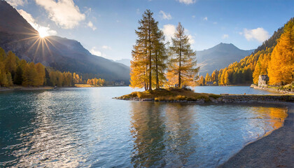 Morning ambiance at Lake Sils, with an island adorned by autumn larches, located in Engadin, Canton of Grisons, Switzerland, Europe