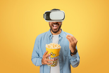 Man eating popcorn experiencing VR technology