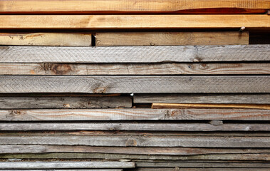 Stack of wooden bars. Wood processing. Stack of pine wood board