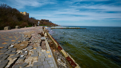 Obraz premium Damaged walking path near the sea. Gold Coast, Odessa, Ukraine
