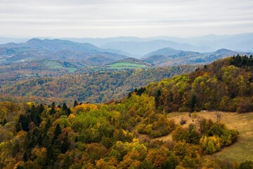 Scenic view of hills with colorful autumn trees. Sitno hill in Stiavnicke Vrchy, Slovakia.
