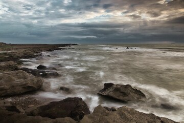 Beautiful shot of the scenic rocky White Cliff Bay of the Isle of Wight on a gloomy day