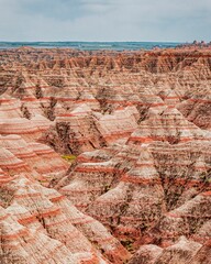 Aerial view of the badlands with the hues of red and tan creating a stark contrast