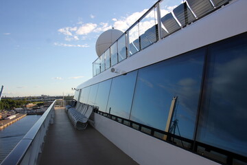 On the upper deck of a large ocean liner.