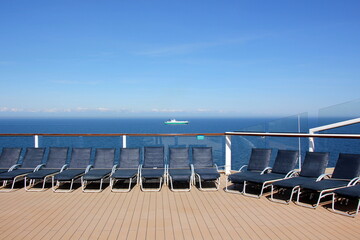 On the upper deck of a large ocean liner.
