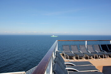 On the upper deck of a large ocean liner.