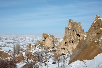 Beautiful shot of the fairy chimneys and the Goreme Open Air Museum in Cappadocia on a snowy day