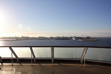 On the upper deck of a large ocean liner.