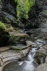 Stream of water cascades over a rocky landscape