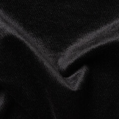 Close-up of crumpled black satin fabric texture background