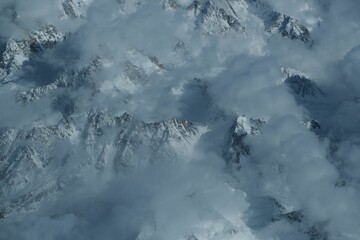 Fototapeta na wymiar Aerial view of the majestic Hindu Kush mountain range blanketed in snow