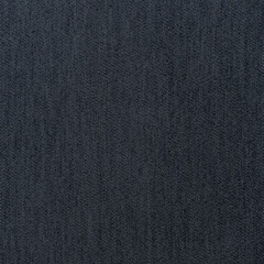 The fabric is dark grey, with a slight roughness, the material allowing the light to pass through it.