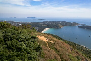 Aerial view of Nai Harn Beach in Phuket, surrounded by lush tropical vegetation