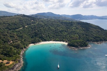 Fototapeta na wymiar Aerial view of Freedom Beach in Phuket, surrounded by lush tropical vegetation