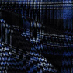 Texture, background, pattern. The fabric is dark blue, with a checkered pattern. Scottish tartan.