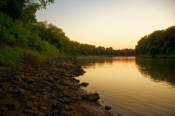 Tranquil moment near a river at sunset in Tisza, Hungary