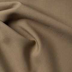 Texture, background, pattern. The fabric is brown. Beige silk or satin.