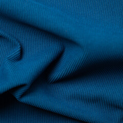 Texture, background, pattern. Blue silk fabric