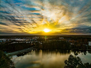 Fototapeta na wymiar Aerial view of Harbison Lake, located in South Carolina featuring a beautiful sunset