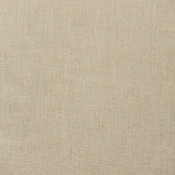 Closeup detail of beige fabric texture background. High resolution photo.