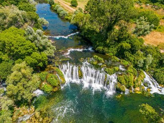 Fototapeta na wymiar Aerial shot of the Kocusa Waterfall in Bosnia and Herzegovina.