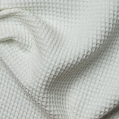 Closeup detail of beige fabric texture background. High resolution photo.