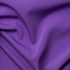 Purple satin fabric as background, close-up. Texture