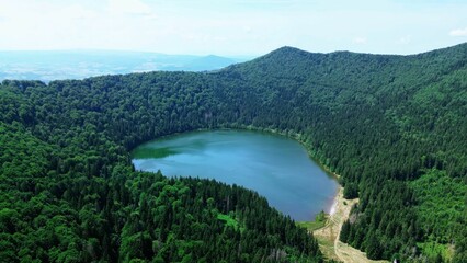 View of a picturesque Saint Anne Lake surrounded by lush green in Romania,