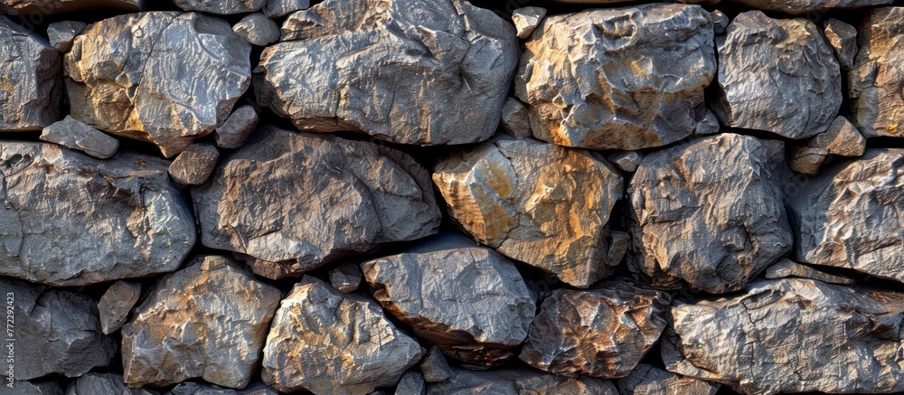 Poster many rocks piled up together in a row, creating a stack of rocks.
