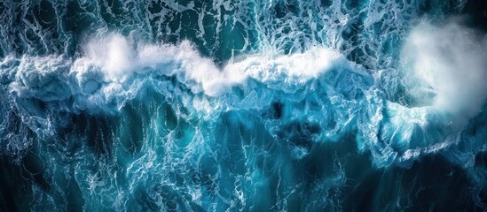 This aerial view captures the vast expanse of a large body of water, showcasing intricate wave patterns and textures. - obrazy, fototapety, plakaty